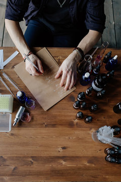 Perfumer writing aroma recipe