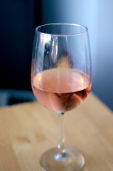 glass of rose wine on table
