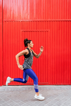Fitness woman jogging outdoors in the city