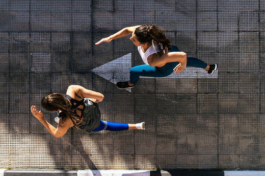 Fitness women jogging outdoors in the city