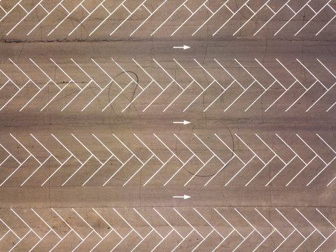 Aerial view from flying drones to parking markings with empty places. Parking background. Top view