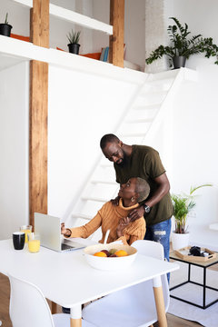 Ethnic couple conversate home.