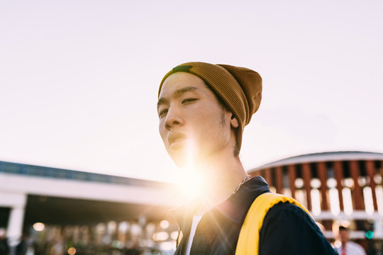 Handsome asian young man looking at camera