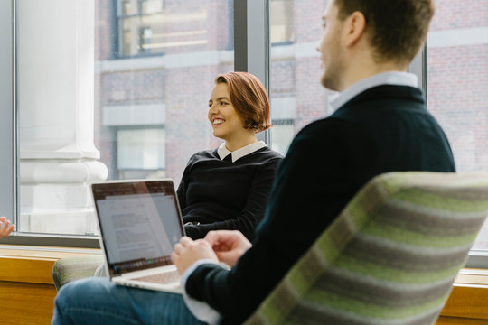 Casual Business Meeting at Office with Hispanic Woman