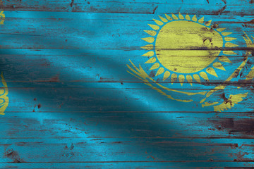 Kazakhstan flag on an old wooden plank forming a background