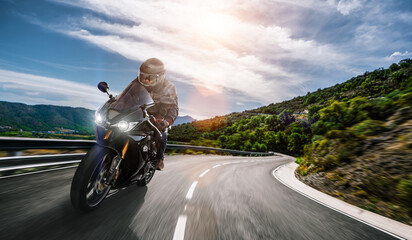 motorbike on the road riding. having fun driving the empty highway on a motorcycle tour journey