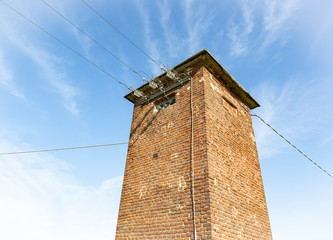 old transformer building against a blue sky 