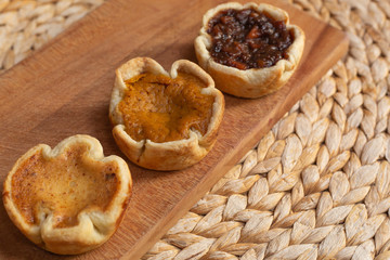 Trio of holiday tarts - pumpkin, mincemeat and butter tart