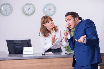 Young businessman at hotel reception