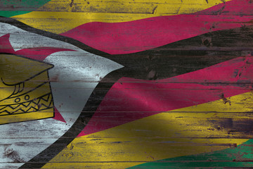 Zimbabwe flag on an old wooden plank forming a background
