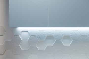 Kitchen cabinet on wall with hexagon tiles in modern kitchen