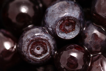 Background of fruits of the blueberries. Fresh food in macro.