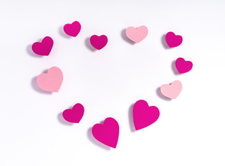 Heart shape made of paper hearts on white paper background. Valentine's day concept