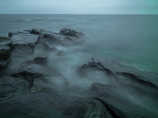 misty lake shore rocky