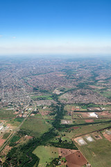 Obraz premium Top view of a city with low density constructions, few tall buildings. Aerial view of Campo Grande MS, the capital of Mato Grosso do Sul, Brazil - 2019 photo. South region of the city. 