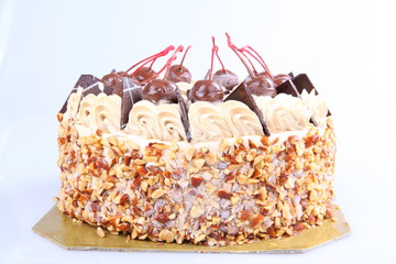 Close-up of homemade chocolate cake on brown canvas.