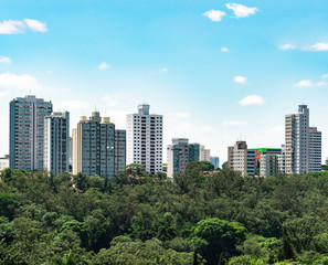 High density tall buildings surrounded by trees. Eco city. Buildings of the central region of Sao...