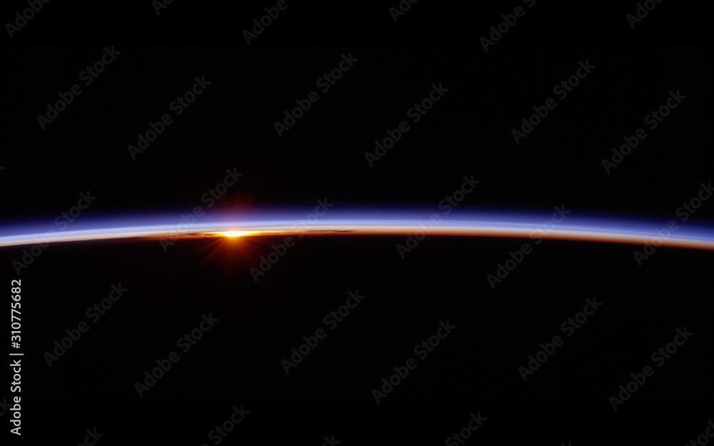 Wall mural observation of sunrise over the earth. view of planet earth from space.elements of this image furnis