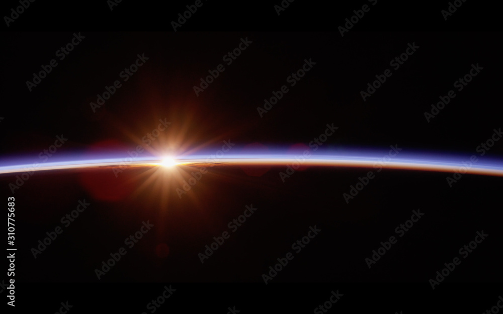 Wall mural observation of sunrise over the earth. view of planet earth from space.elements of this image furnis