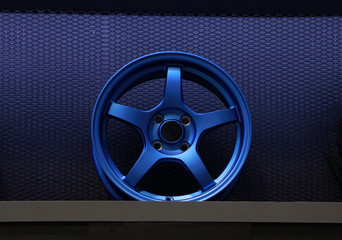 Alloy Wheel of car on the shelf. Alloy wheels are wheels that are made from an alloy of aluminium...