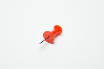 Close up of Red pin  on white background