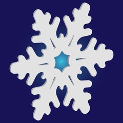 Christmas paper snowflake on blue background.