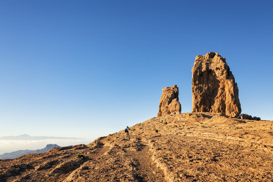 Tourist taking a photo of Roque Nublo, Gran Canaria in the Canary Islands