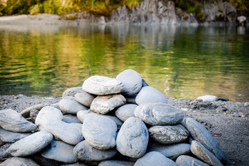 Stones balance and wellness retro spa concept, peaceful and unique inspiration, zen-like and well being tranquil composition. Closeup of white pebbles stack over