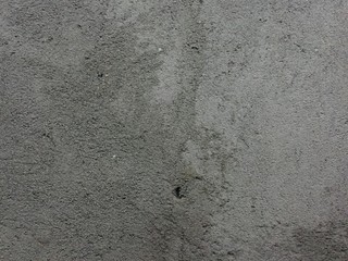 Dark wall abstract texture from cement with stone for background. Home construction from Indonesia, Asia.