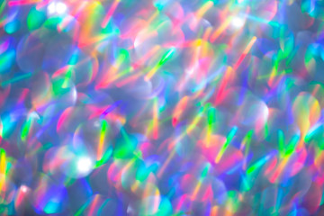 Blurred background with holographic sparkles and lights.