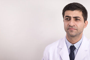 Portrait, A male doctor wearing a white coat in the hospital