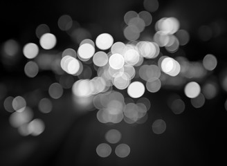 Night city street lights bokeh background, black and white