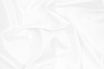 White fabric background with soft waves.