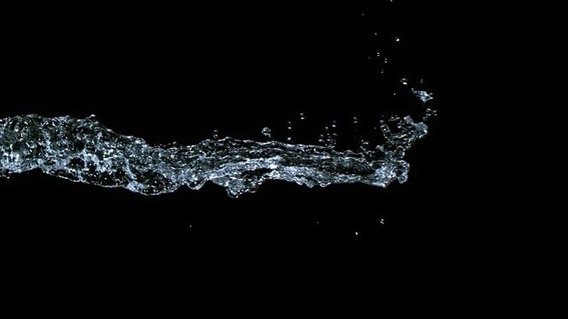 Super Slow Motion Shot of Water Splash on Black Background at 1000fps.
