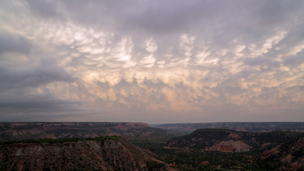 Sunset over Palo Duro Canyon in Texas viewing mammatus with vibrant color in the sky.