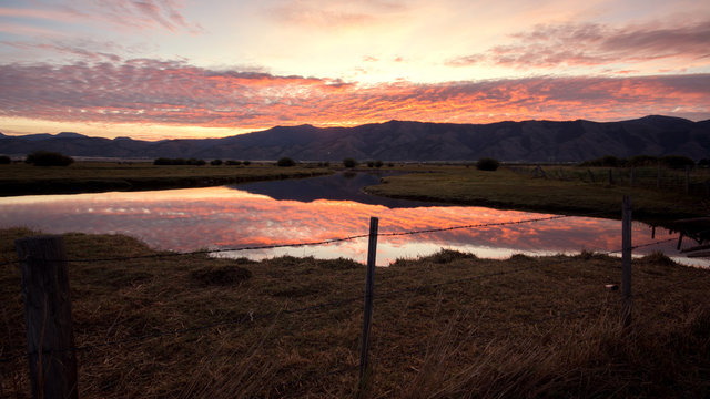 Sunrise reflecting in the Salt River in the Wyoming landscape in Star Valley.