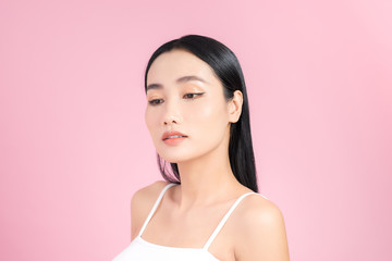 Portrait of Asian healthy skin woman beautiful face close up over pink background