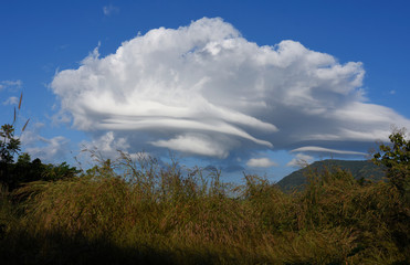Lenticular Wind Cloud Resembling A Ufo Flying Saucer Over  Mountain In Countryside , Thailand 