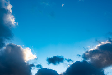 Naklejka premium Blue sky with black clouds. Blue sky with white clouds