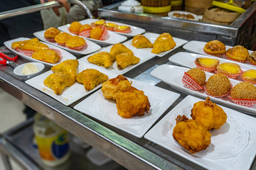 Assortment of Chinese fried dumplings and cakes in dimsum restaurant