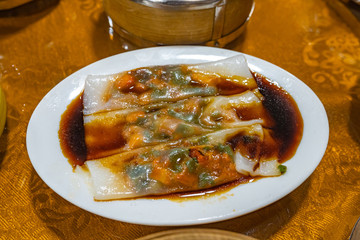 Chinese steamed rice rolls stuffed with minced meats 