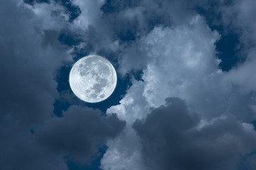 Naklejka na ściany i meble Bright full moon with clouds on the sky.
