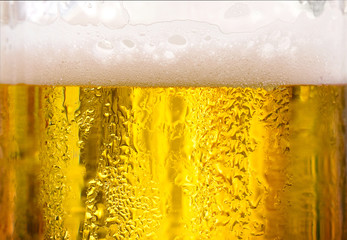 Background Cool beers with beer bubbles on top a glass at the party