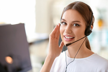 Female technical support agent working in office