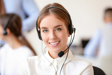 Female technical support agent working in office