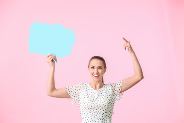 Young woman with blank speech bubble on color background