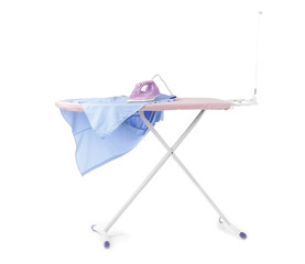 Iron and clean clothes on board against white background