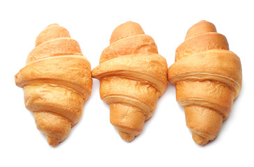 Tasty croissants on white background