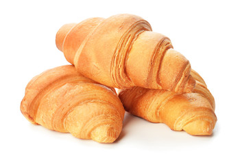 Tasty croissants on white background