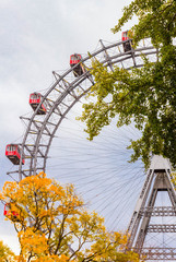 Ferris wheel with red retro cabs in Prater. Vienna Giant Wheel in Amusement Park, Vienna, Austria